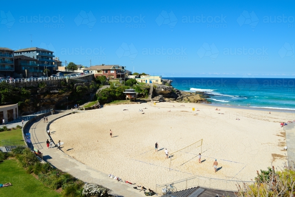 View of beach with sand in foreground and ocean in background - Australian Stock Image