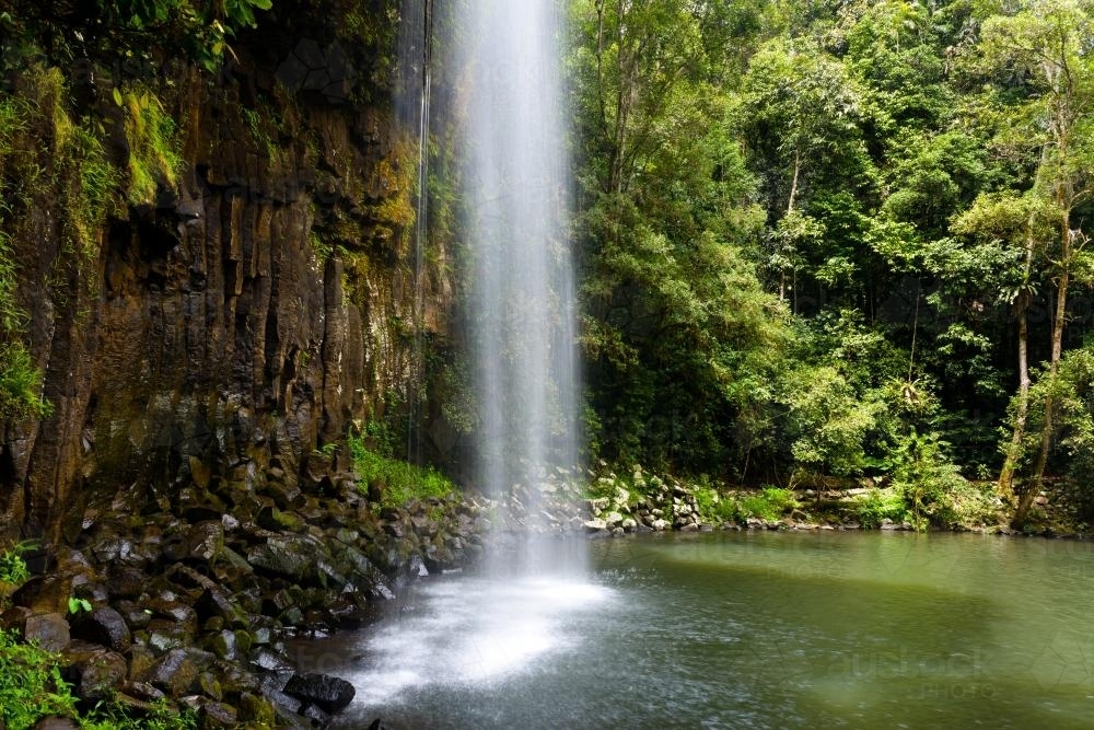 View of beautiful waterfall  and plunge pool in green bushland - Australian Stock Image