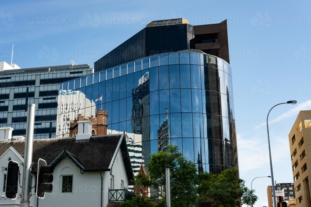 View of church and other city buildings with reflections - Australian Stock Image