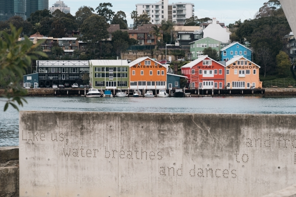 view of colourful boat-sheds on the harbour in Sydney - Australian Stock Image