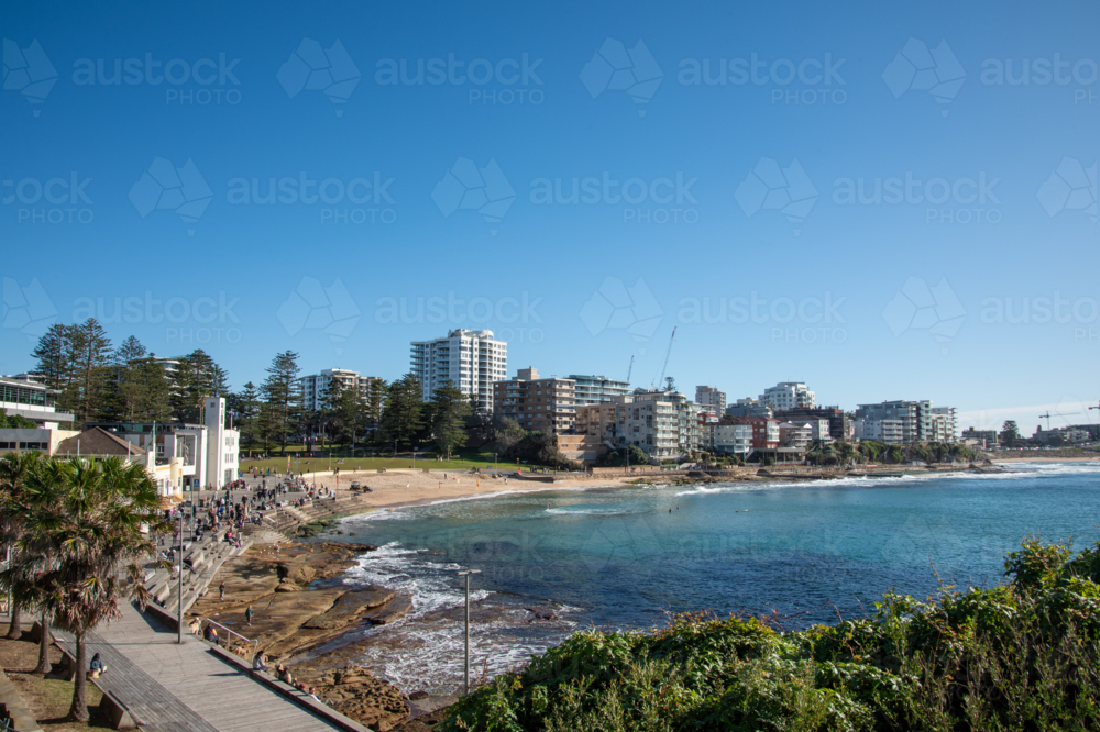 View of Cronulla beach from the esplanade on a sunny morning - Australian Stock Image