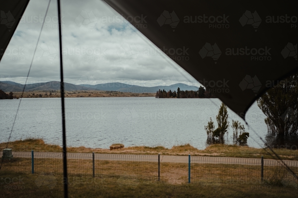 View of Lake Jindabyne while camping on overcast day - Australian Stock Image