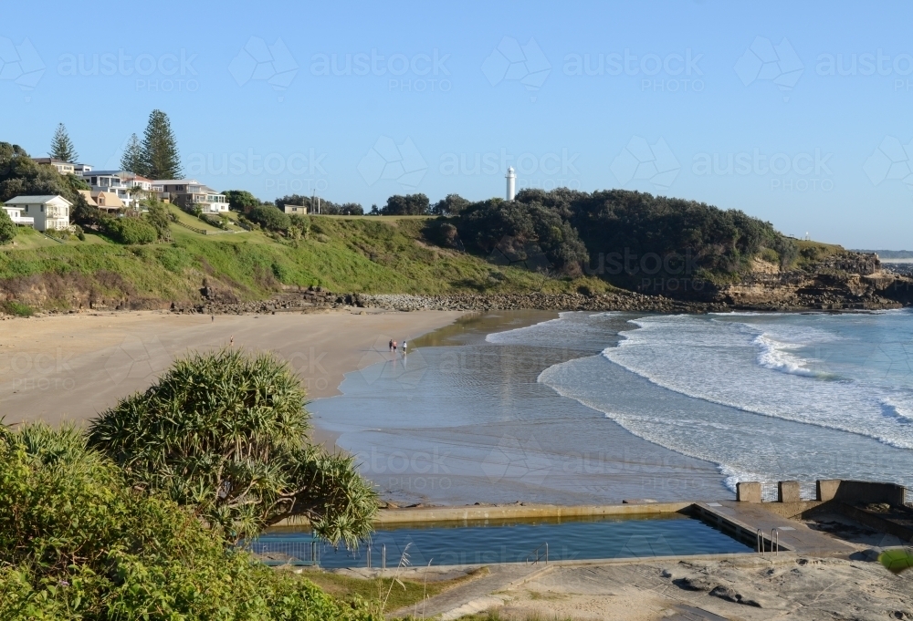 View of Main Beach, Yamba, with ocean pool in foreground - Australian Stock Image