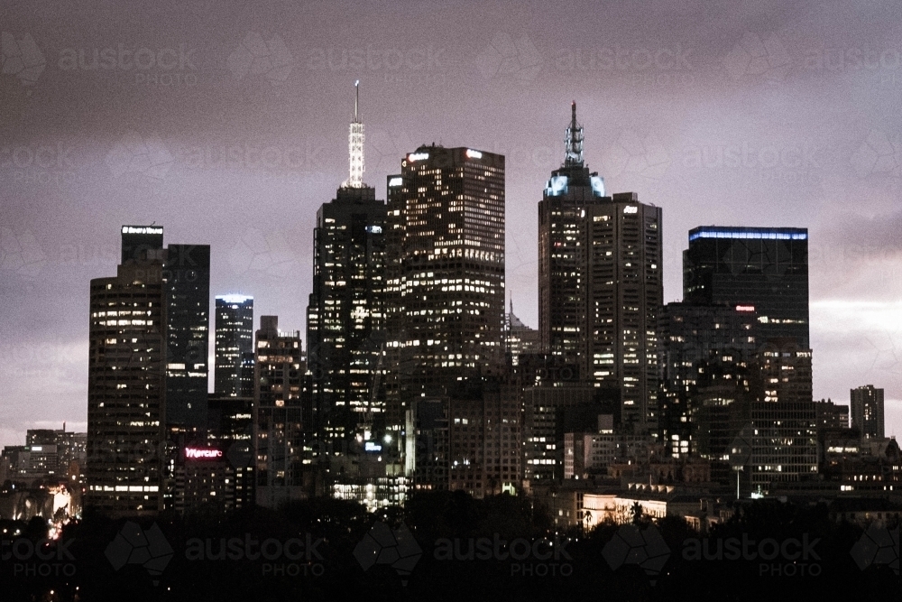 view of Melbourne city scape at night in a purple lit sky - Australian Stock Image