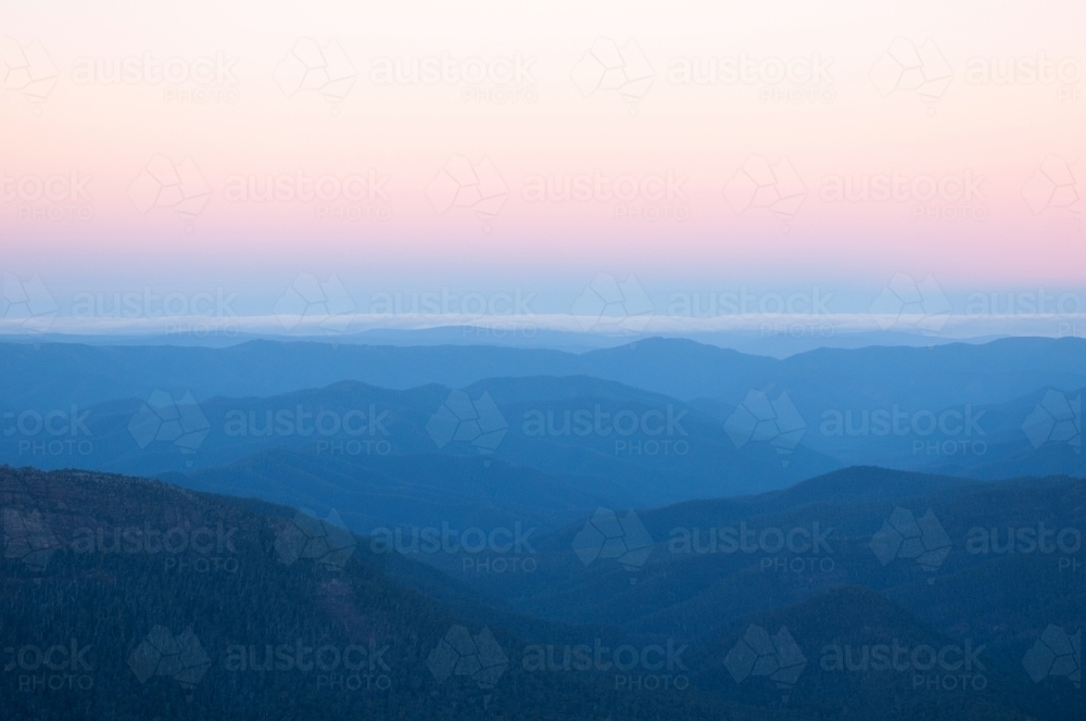 View of mountain ranges at sunset - Australian Stock Image