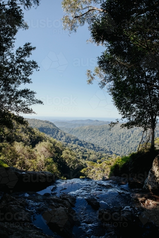 View of mountains and a flowing water - Australian Stock Image