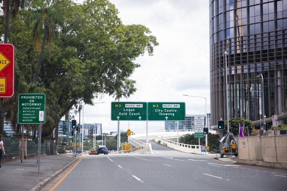 view of road signs while driving towards captain cook bridge and riverside expressway in Brisbane - Australian Stock Image