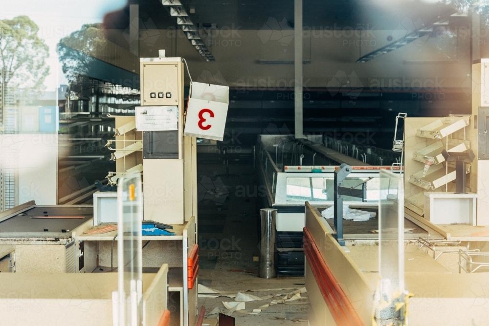 View of shelves and boxes of an empty supermarket - Australian Stock Image