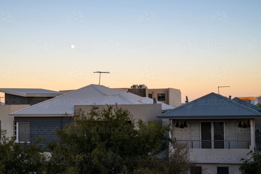 View of sunset over roof tops - Australian Stock Image