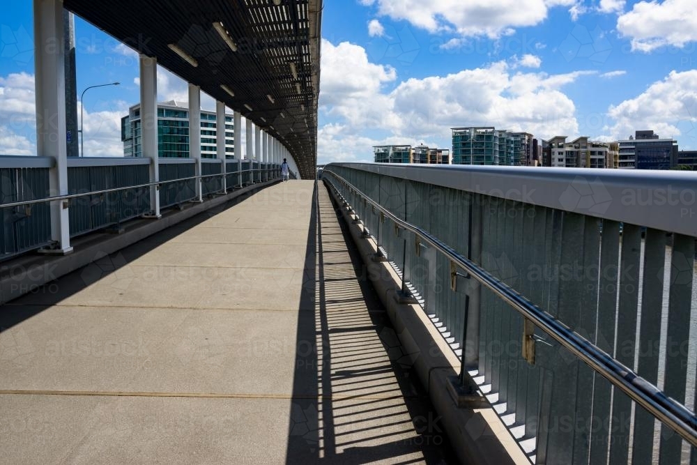 View of the pedestrian and bikeway on the Go Between Bridge with pedestrian in distance - Australian Stock Image