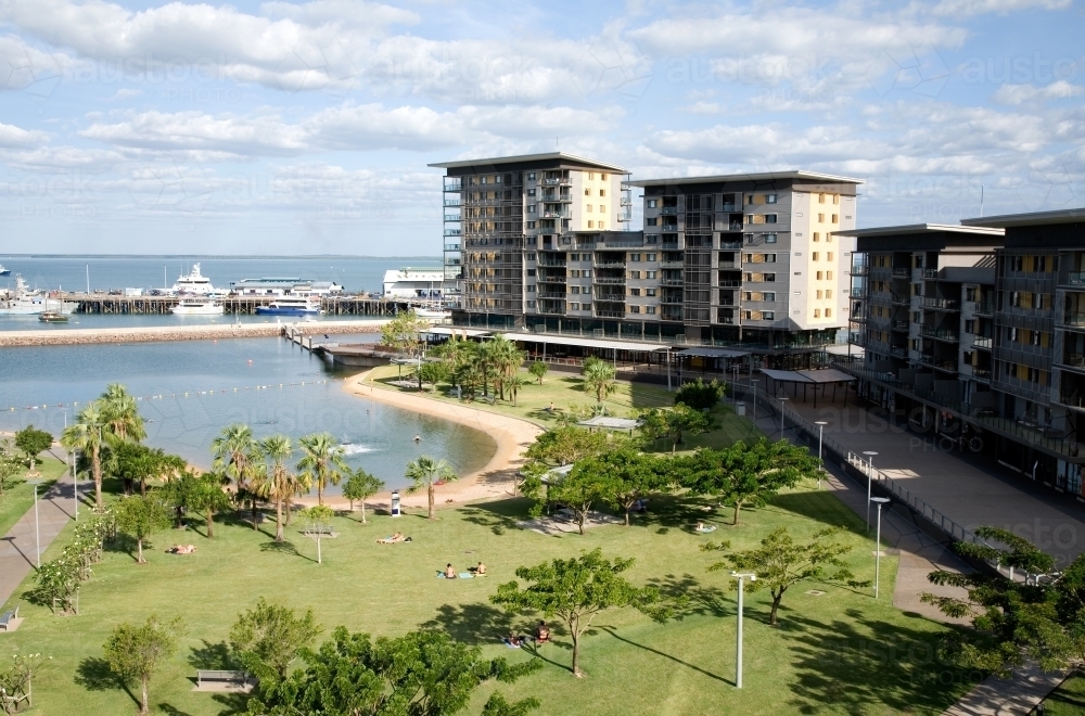 View of waterfront apartments and parkland surrounding Darwin harbour and lagoon - Australian Stock Image