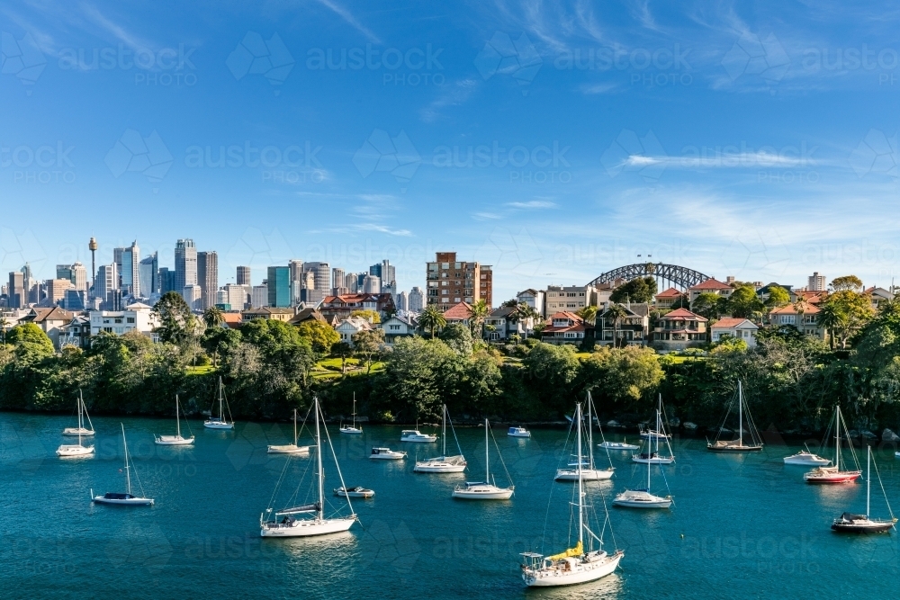 View of yachts in harbour with Sydney city behind - Australian Stock Image