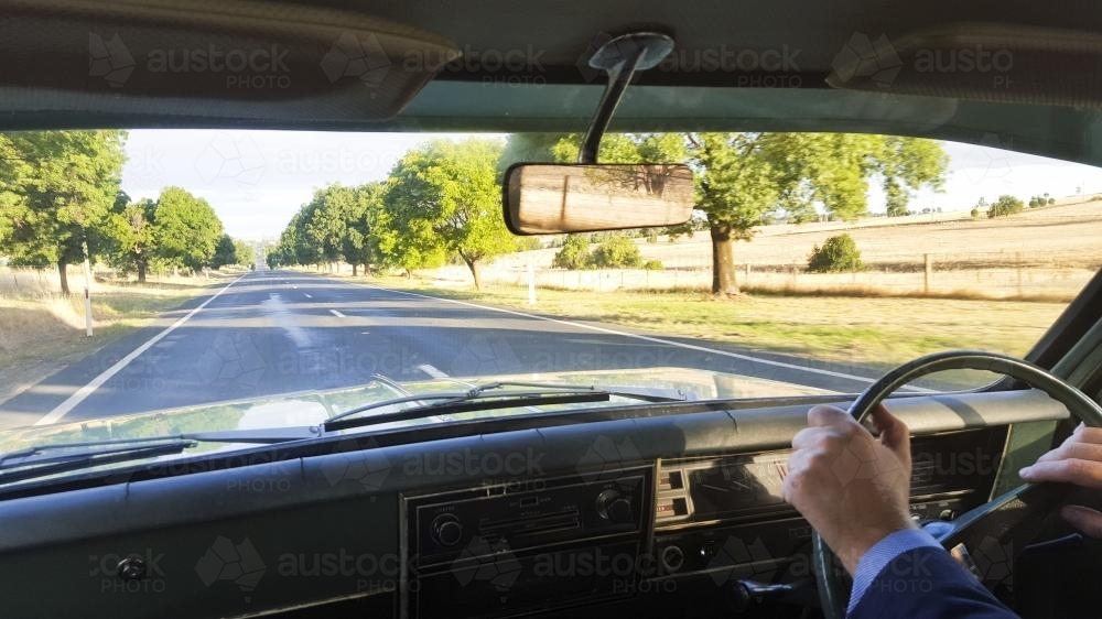 View out the front window of a classic car driving in the country - Australian Stock Image