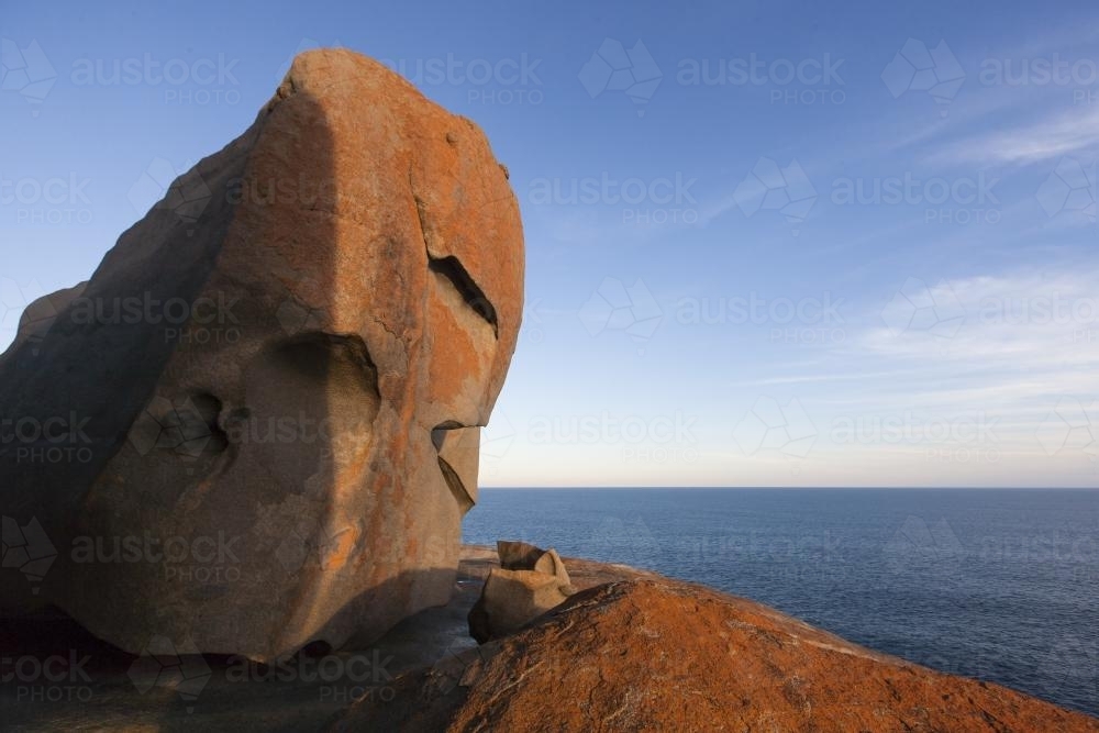 View over flat sea from the red formation of Remarkable Rocks - Australian Stock Image