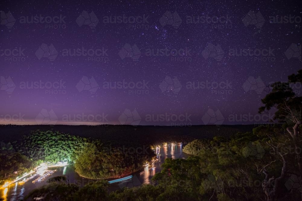 View over river homes at Berowra Waters at night - Australian Stock Image