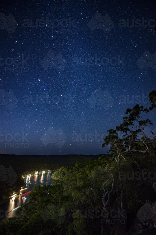View over river homes at Berowra Waters at night - Australian Stock Image
