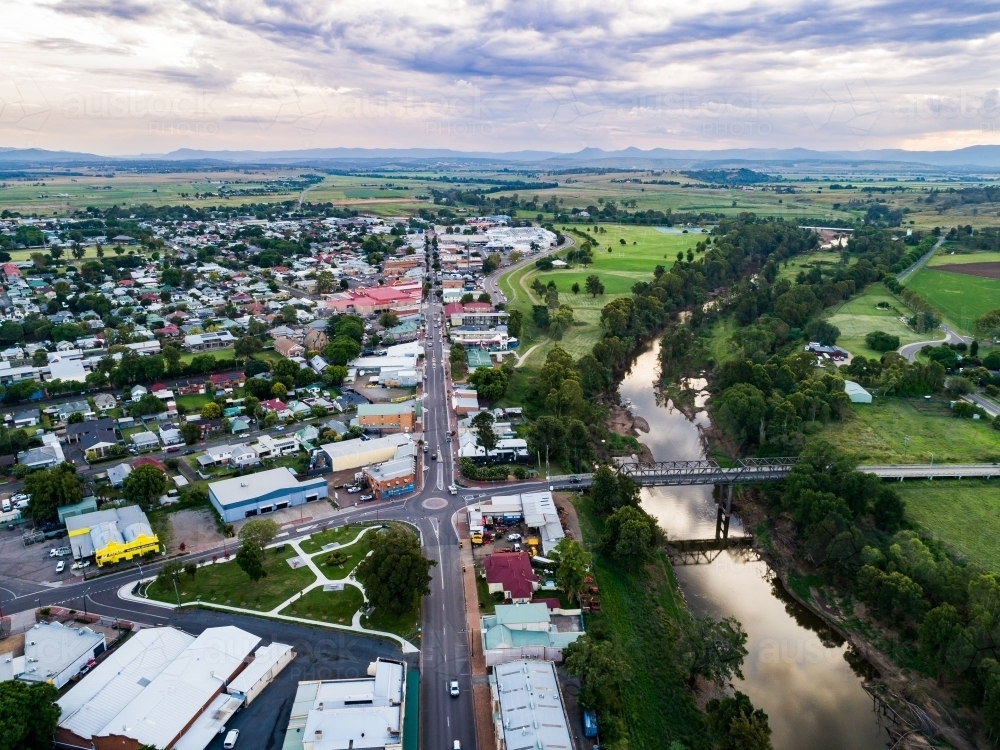 View over riverside country town in NSW Australia at dusk looking down main street John Street - Australian Stock Image