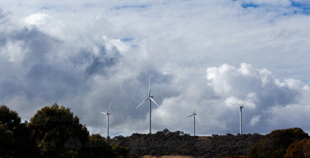 Image of View through car windscreen of wind turbines on horizon ...