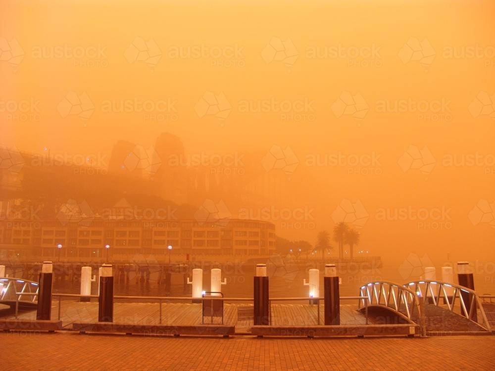 View through red dust storm of Sydney Harbour Bridge - Australian Stock Image
