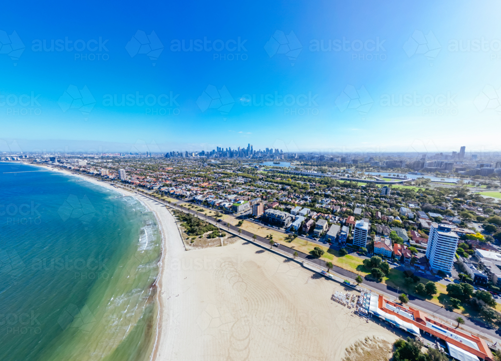 View towards Melbourne skyline on a warm summer's morning from St Kilda West Beach in Australia - Australian Stock Image