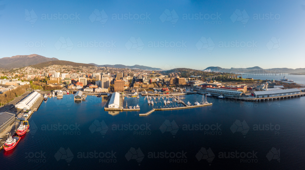 View towards Mt Wellington over the wharf area and CBD in Hobart, Tasmania - Australian Stock Image