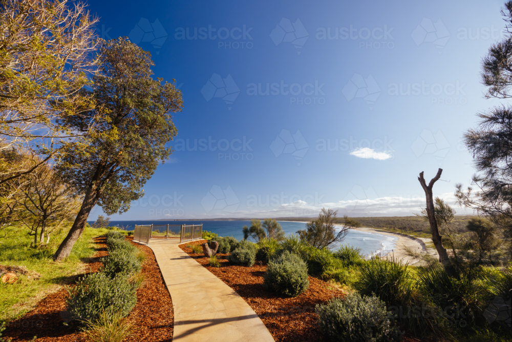 Views from Broulee lookout over Broulee Beach on a warm sunny spring day - Australian Stock Image