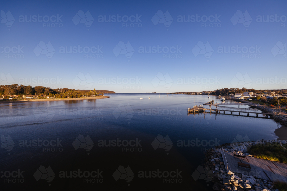 Views from Foreshore Park in Batemans Bay along the Clyde River on a warm sunny spring evening - Australian Stock Image