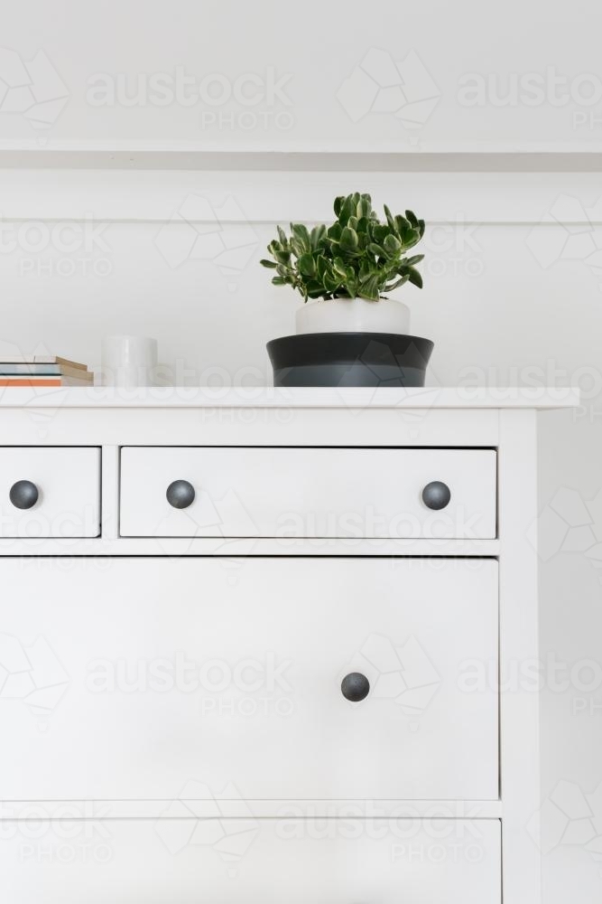 Vignette of interior styled ornaments and objects in Swedish themed bedroom - Australian Stock Image