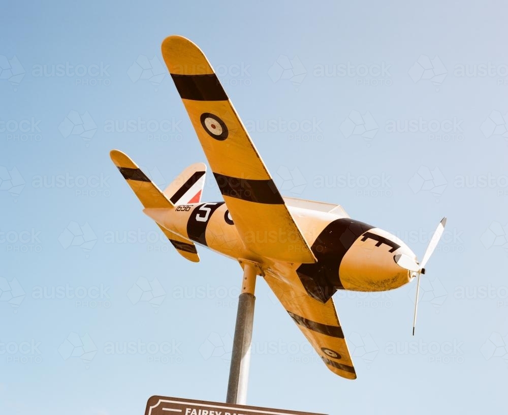 Vintage aeroplane on plinth - Australian Stock Image