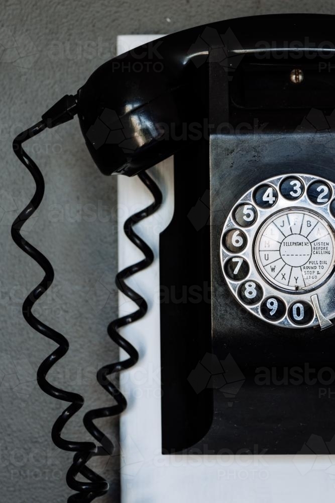 Image of vintage black wall phone Austockphoto
