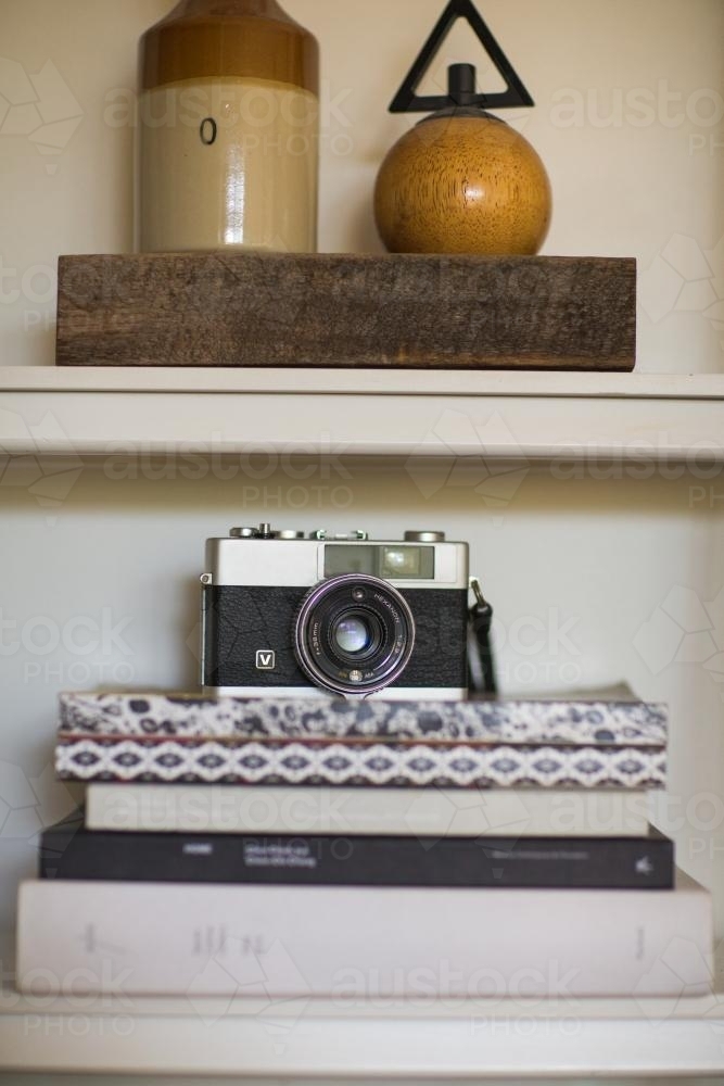 vintage camera on shelf - Australian Stock Image