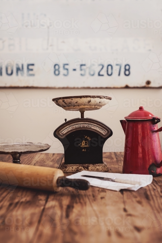 vintage kitchen items on a wooden table - Australian Stock Image