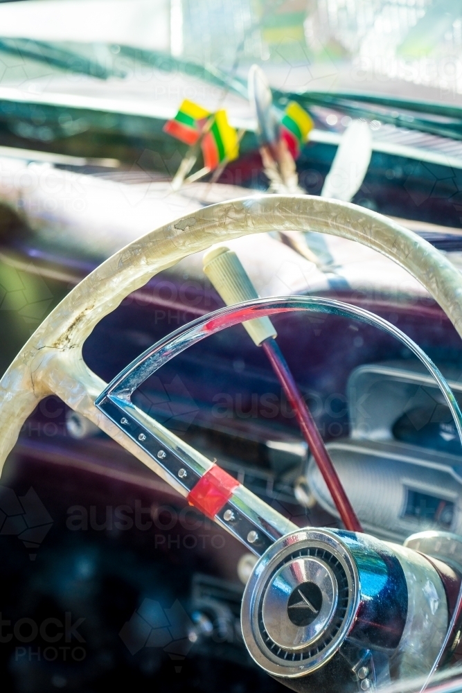 Vintage pearl steering wheel in a car - Australian Stock Image