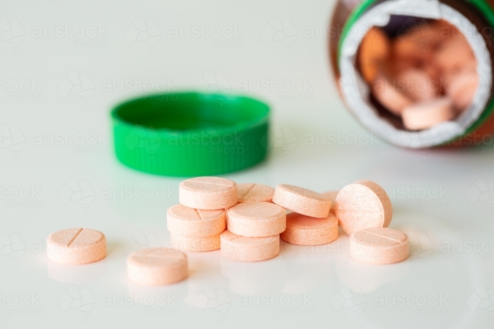 Vitamin c chewable tablets on white - Australian Stock Image