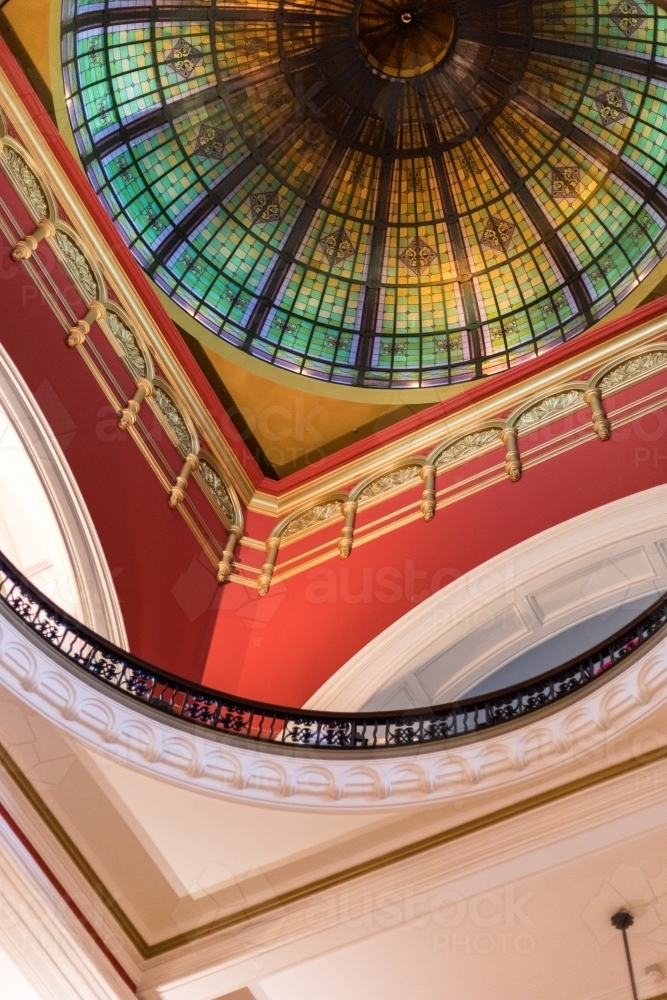 Vivid and ornate interior design with colourful stain-glass dome roof - Australian Stock Image