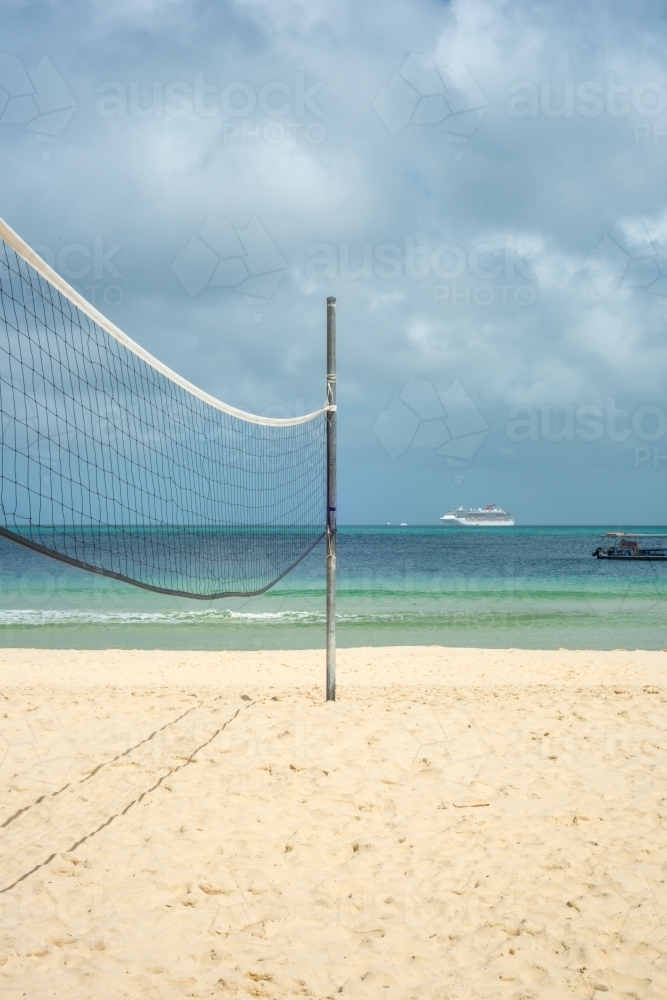 Volleyball net on empty beach - Australian Stock Image