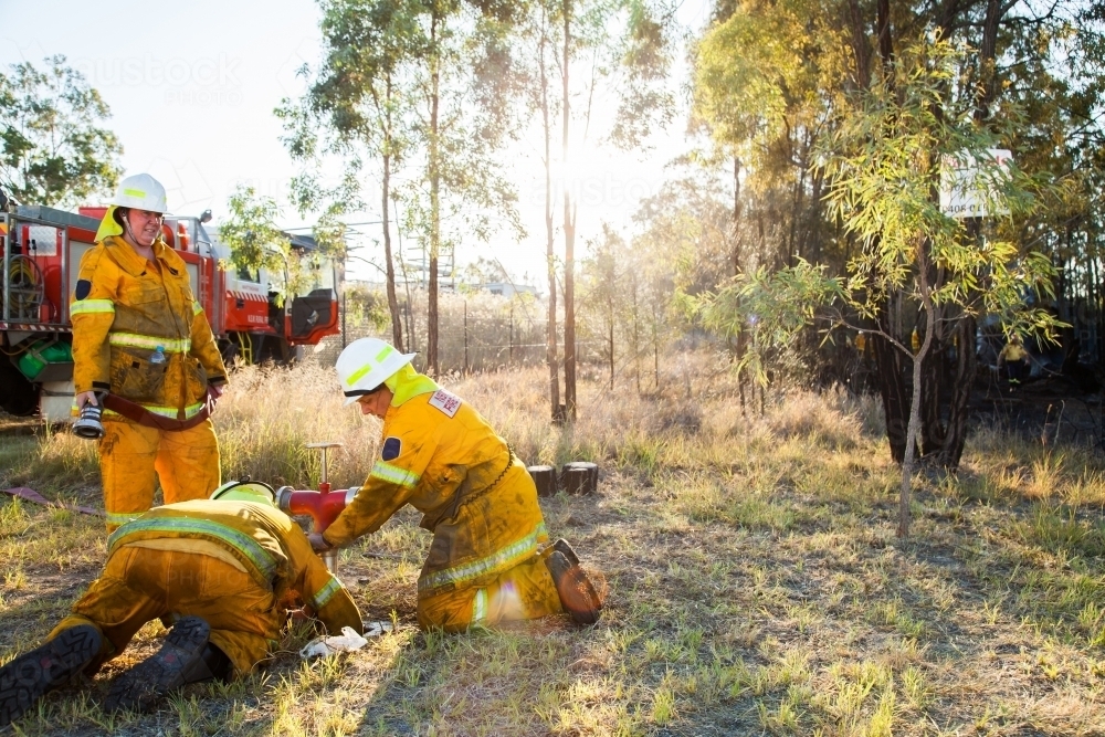 Image of Volunteer firefighters in NSW rural fire brigade attaching ...