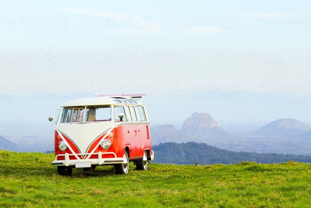 VW Combi van in front of the Glasshouse Mountains. - Australian Stock Image