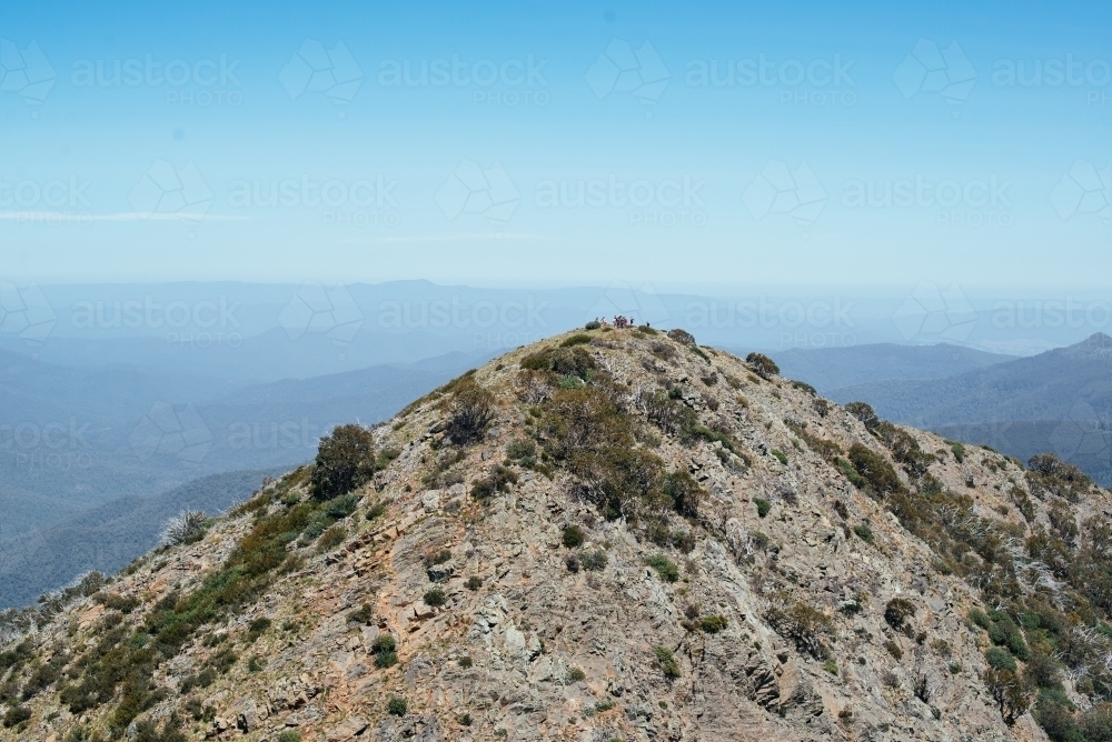 Walkers in distance on West Ridge trail, Mt Buller - Australian Stock Image