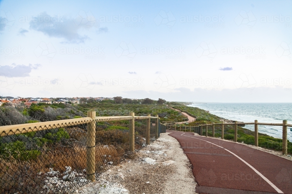 Walking path beside the coast in the evening - Australian Stock Image