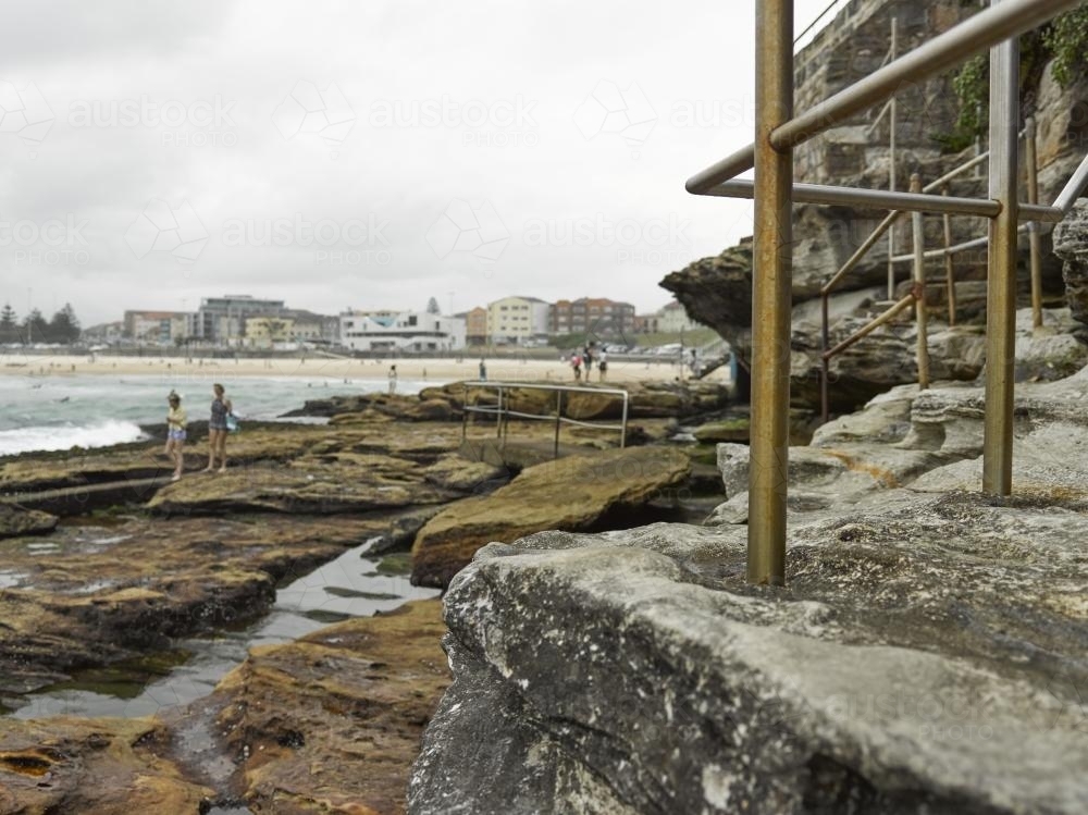 Walking track over rocks at Bondi on an overcast day - Australian Stock Image
