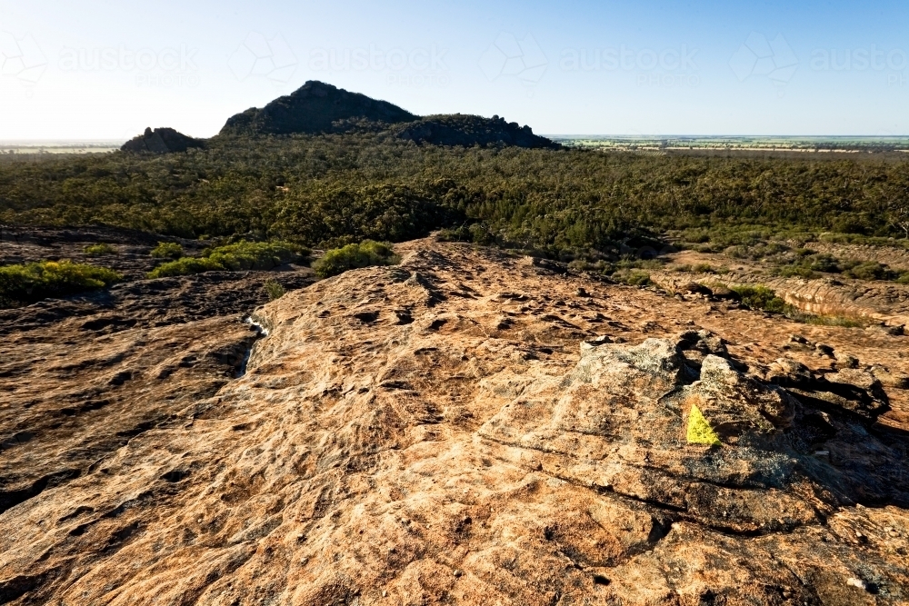 Walking track with marker and mountain in background - Australian Stock Image