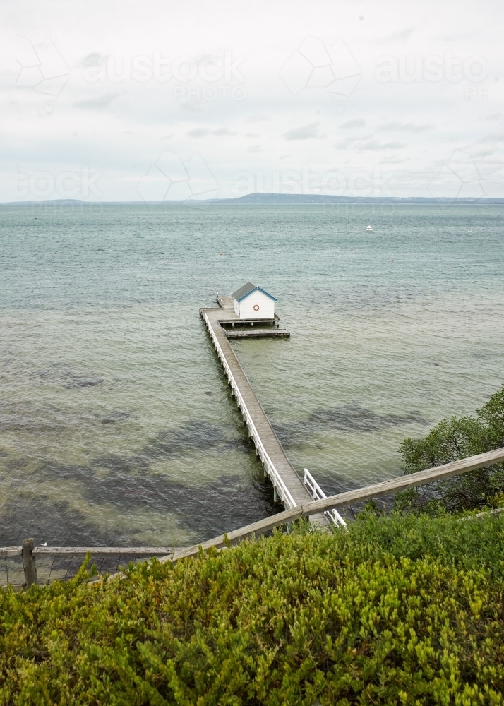 Walkway leading to private jetty and boat shed - Australian Stock Image