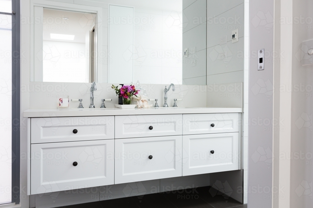 Wall hung vanity in a luxury Hamptons styled bathroom - Australian Stock Image