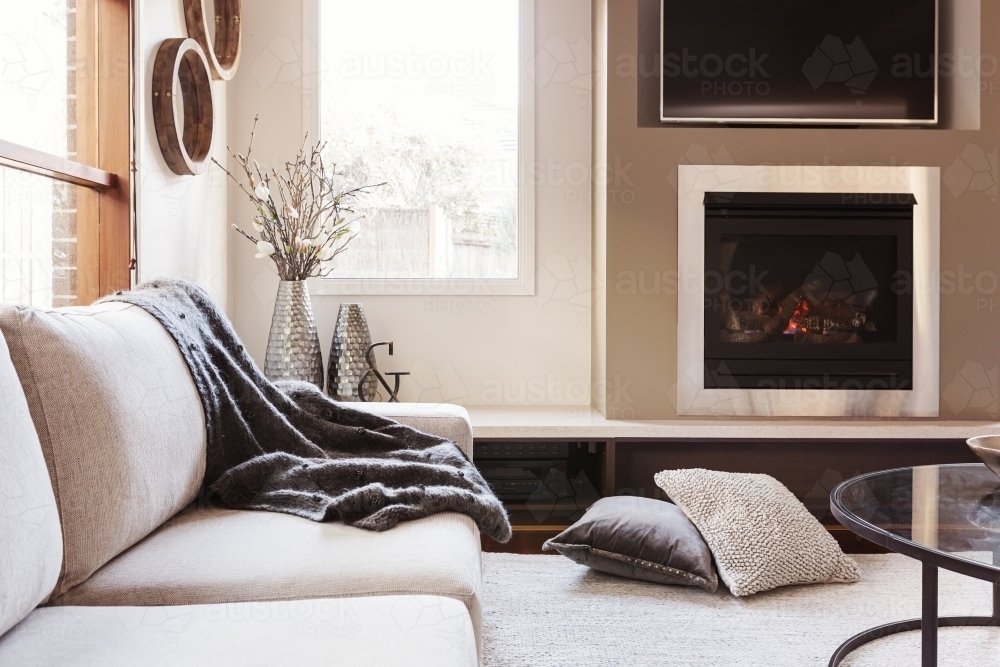 Warm inviting interior with gas log fireplace  - Australian Stock Image