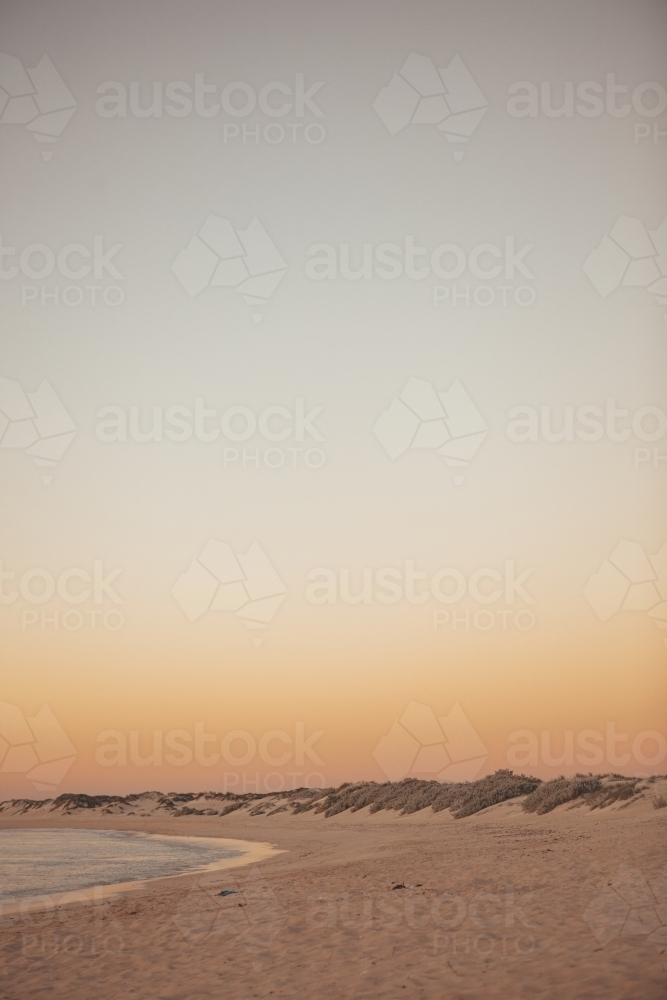 Warm summers evening sunset over beach - Australian Stock Image