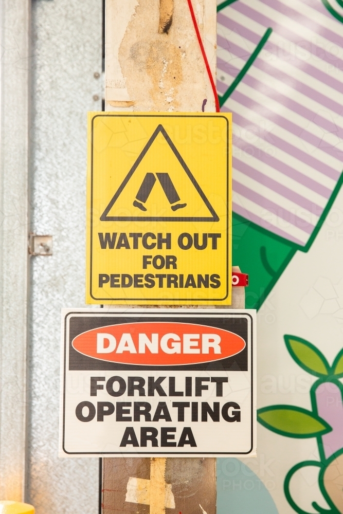 warning signs in an industrial warehouse - Australian Stock Image