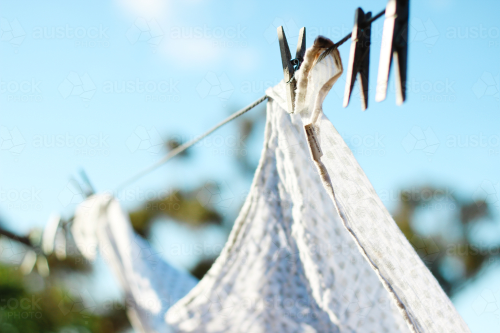 Washing hung on sunlit line - Australian Stock Image
