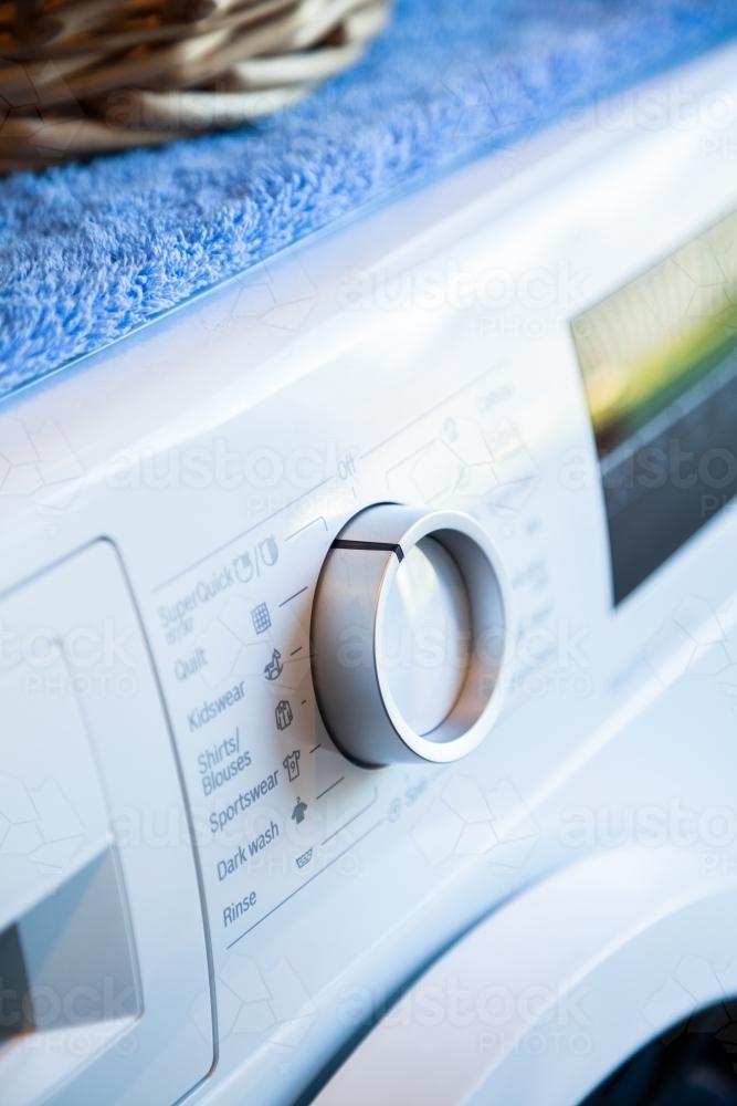 Washing machine in laundry for cleaning clothes - Australian Stock Image