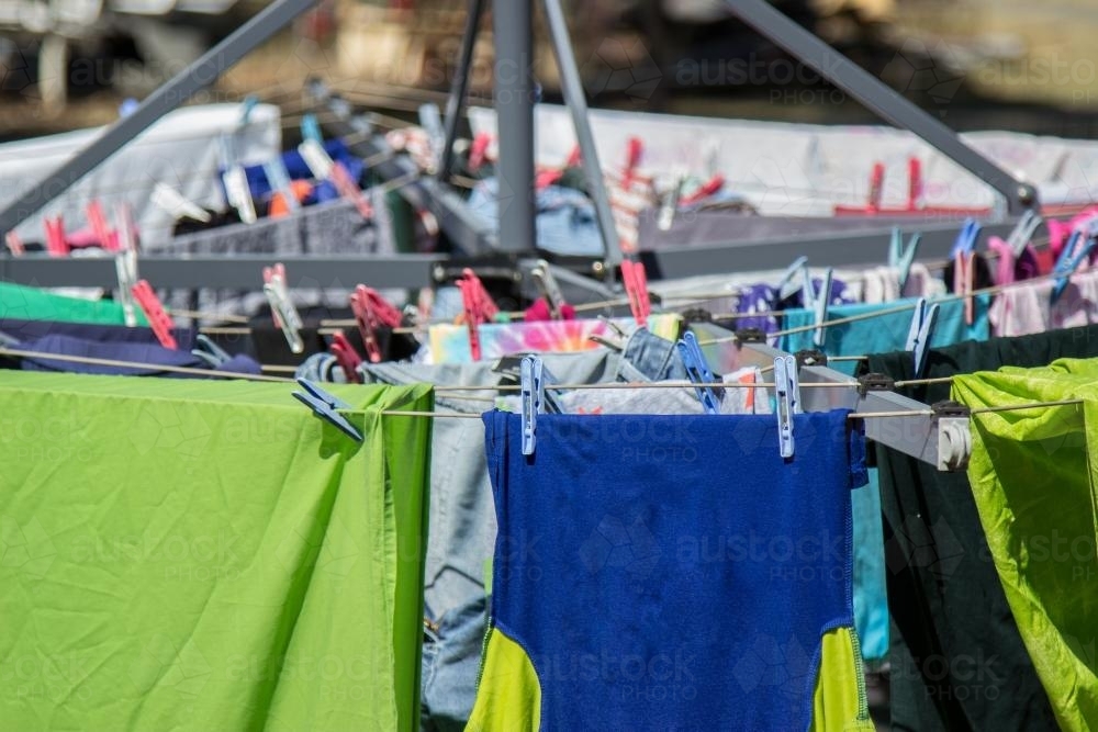 Washing pegged on to a clothes line to dry in the sun - Australian Stock Image